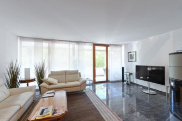 4 ½-Zimmer Eigentumswohnung mit grossem Balkon - Wohnzimmer mit Schwedenofen